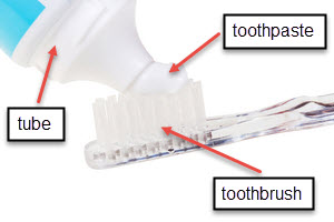 toothpaste tube and toothbrush